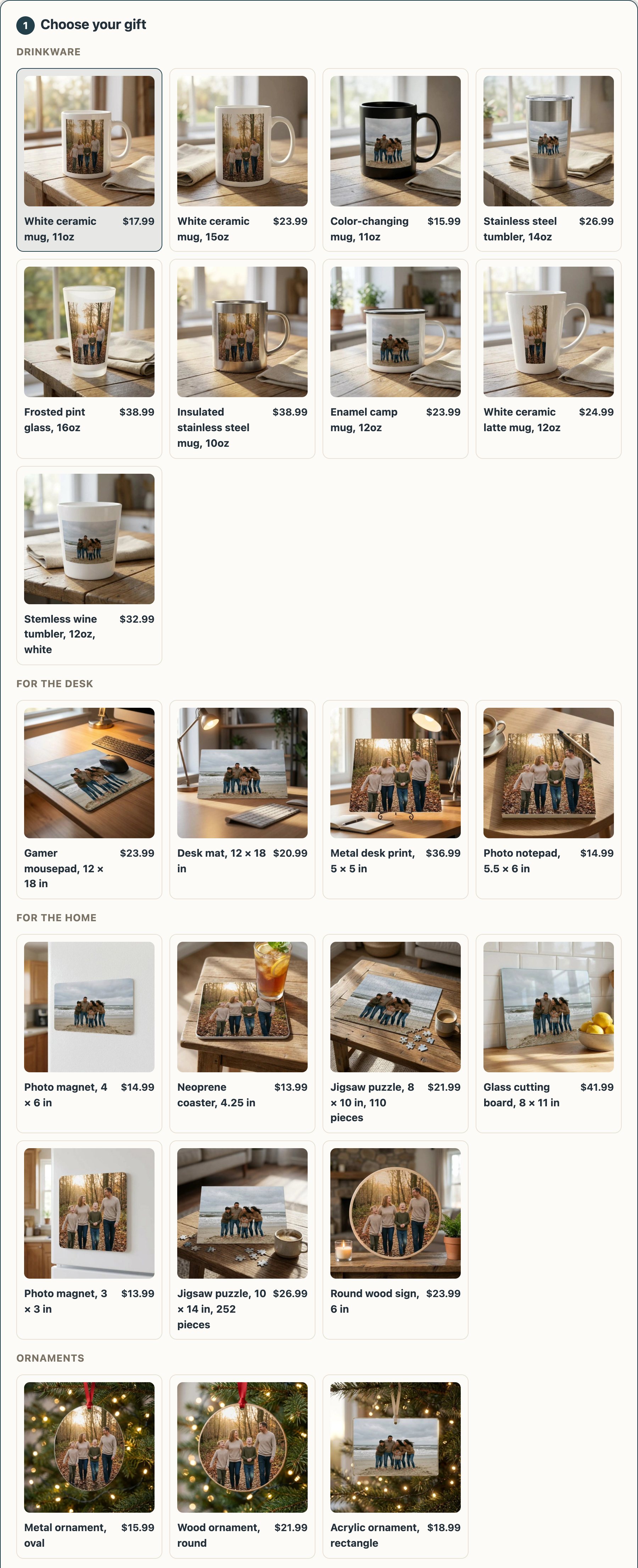 A storefront's gift chooser, every gift photographed where it is used. Drinkware on a kitchen table: an 11oz mug, a 15oz mug, a black color-changing mug, a stainless steel tumbler, a frosted pint glass, a steel camping mug, an enamel mug, a latte mug and a wine tumbler. For the desk: a gamer mousepad, a desk mat, a metal desk print and a notepad. For the home: two photo magnets on a refrigerator door, a coaster, two jigsaw puzzles on a coffee table, a glass cutting board and a round wood sign. Ornaments on a tree: metal, wood and acrylic. Each with a family photo printed on it, and its price